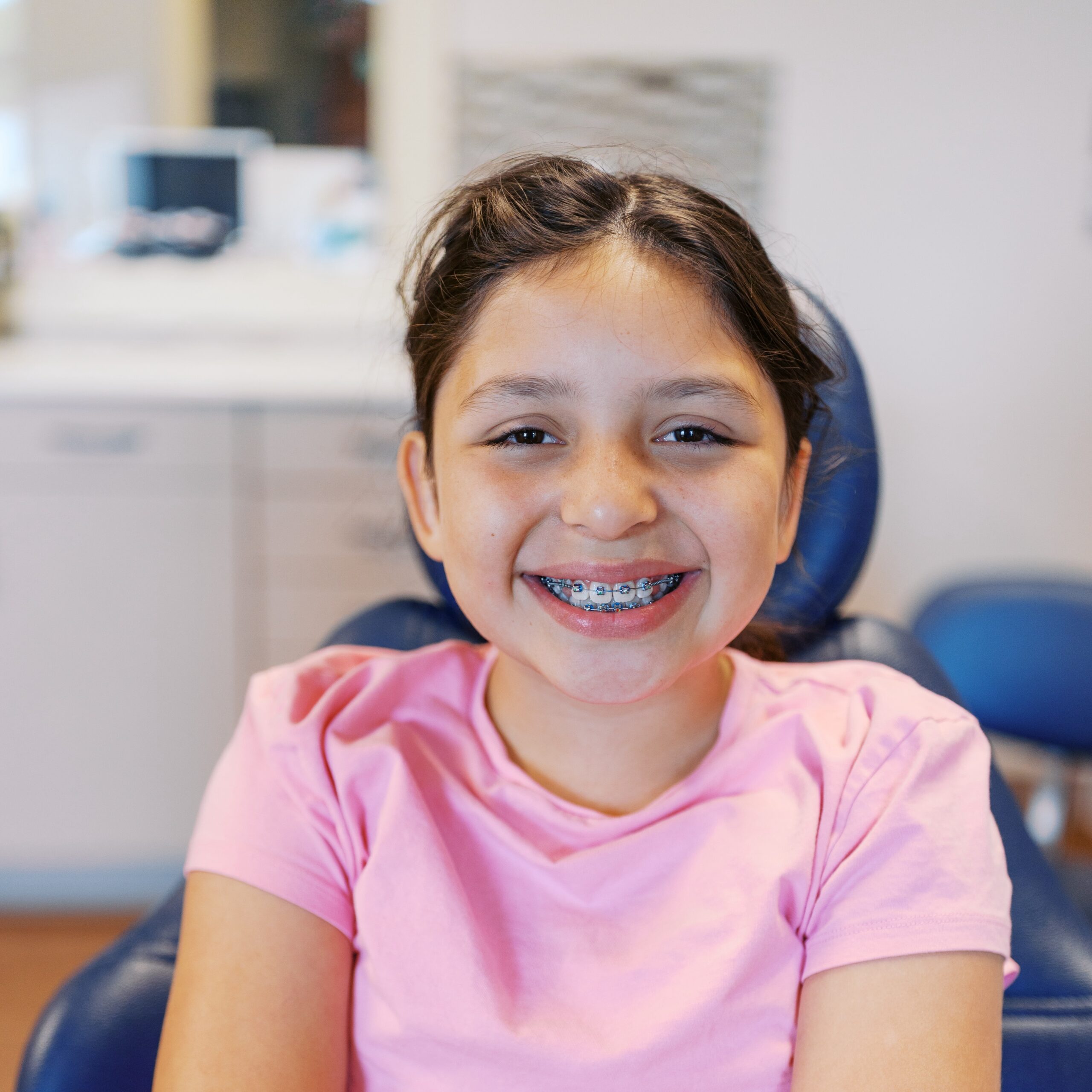 young patient wearing metal braces